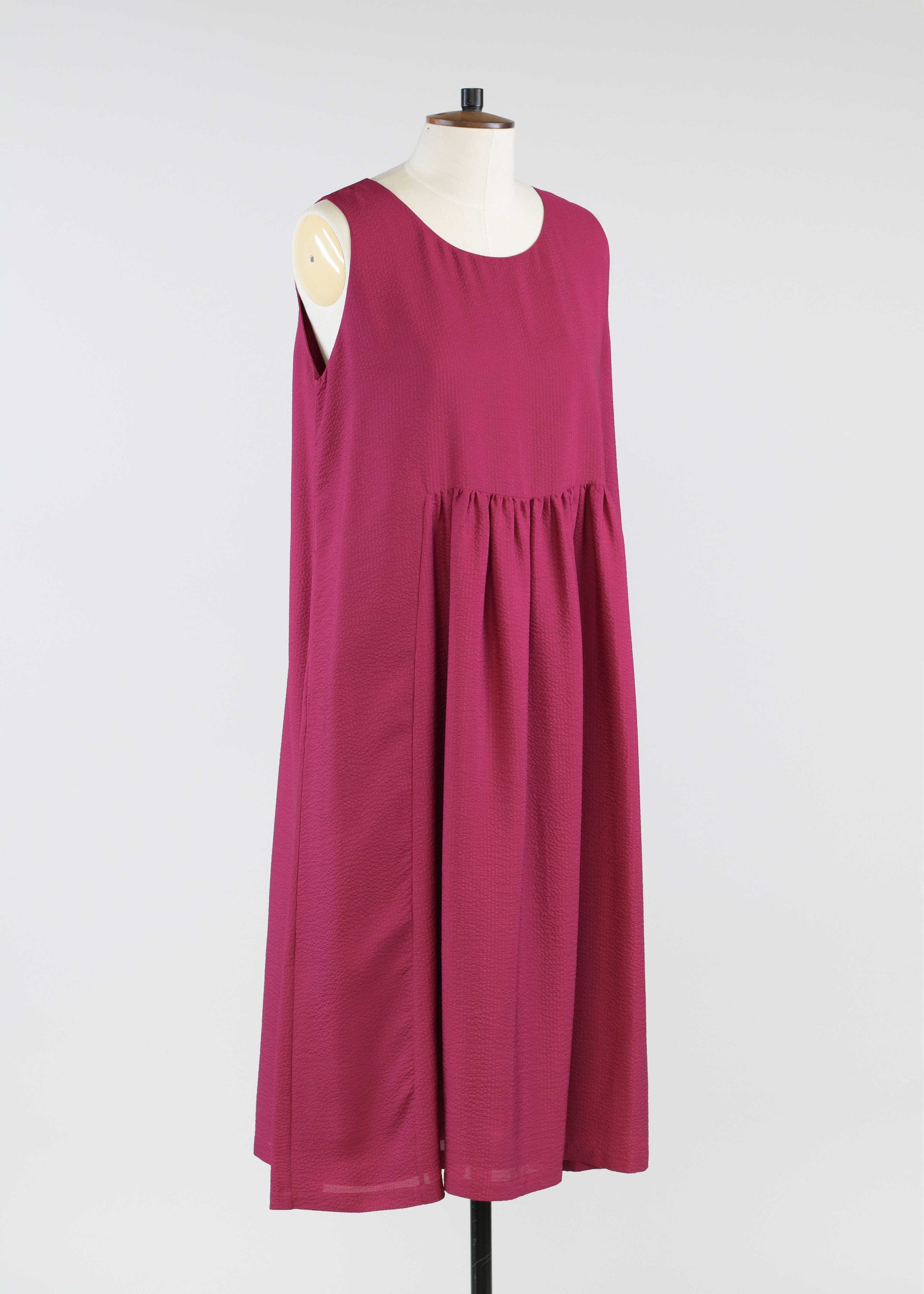 silk sleeveless round neck dress with 'pleated panles'