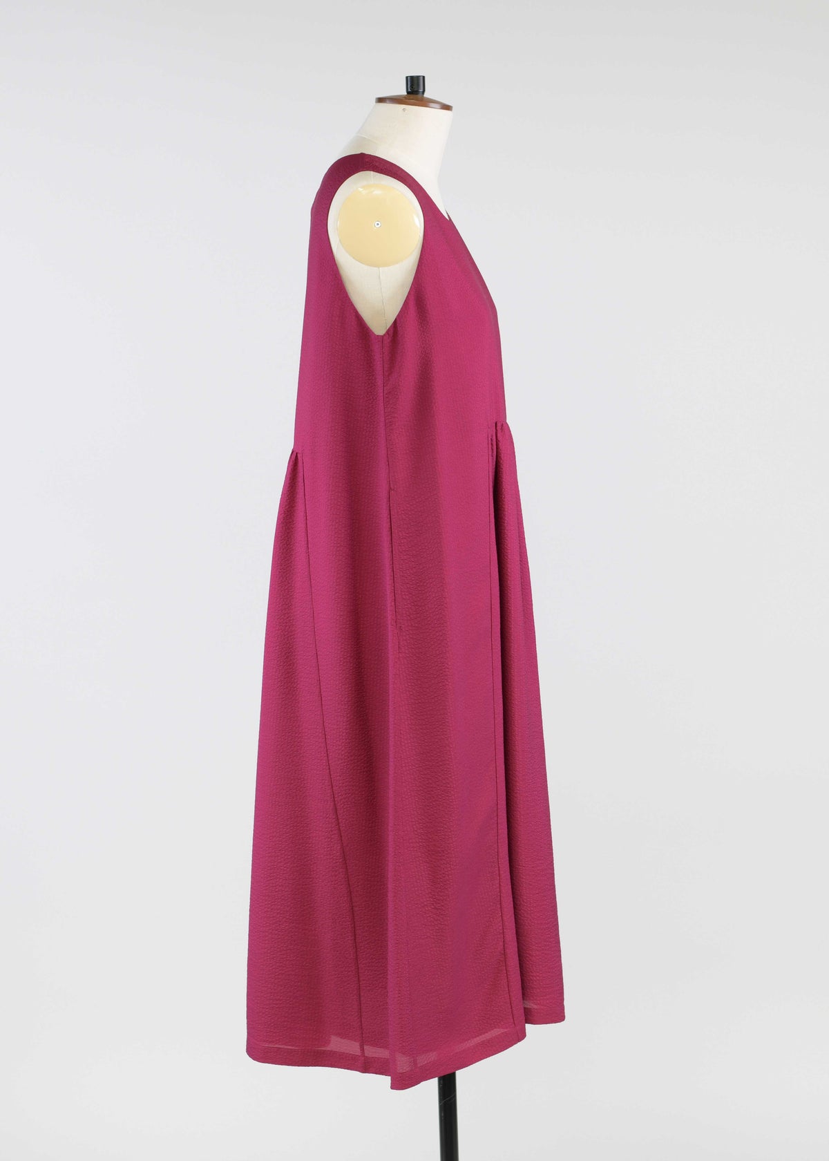 silk sleeveless round neck dress with 'pleated panles'