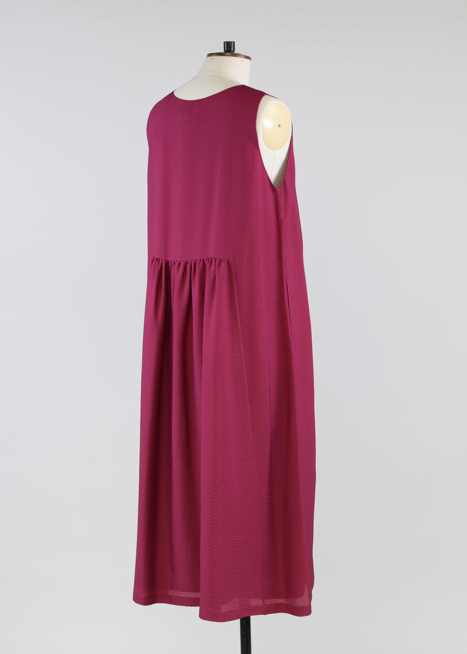 silk sleeveless round neck dress with 'pleated panles'