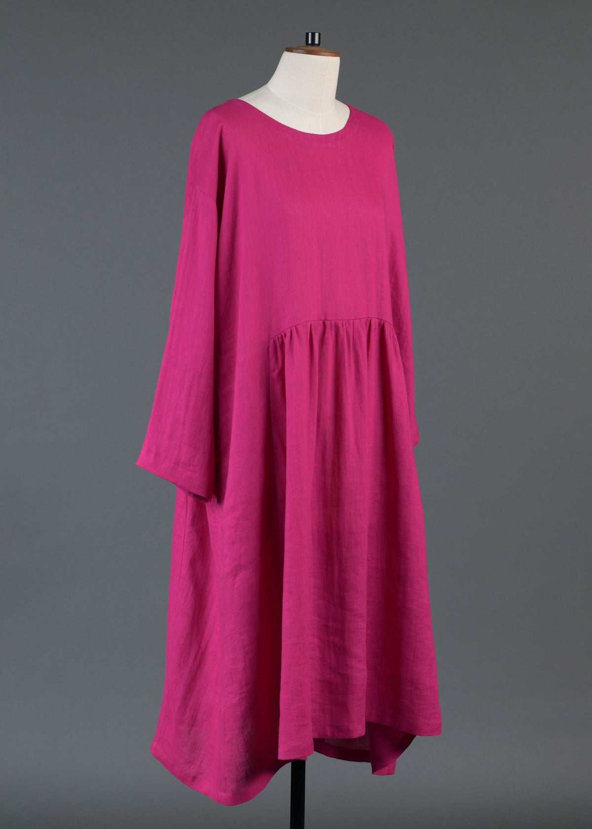linen A-line round neck dress with pleated panels in lipstick